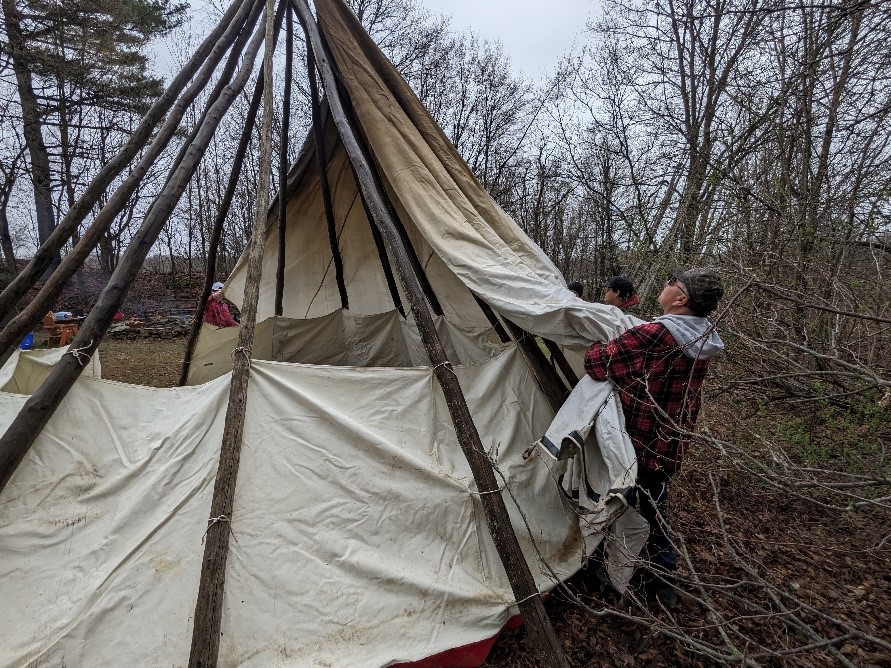 ILOY's elder teaches how to build a tipi